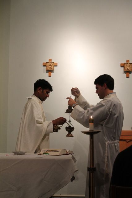 Priest and server with incense for Eucharistic Adoration at TEC retreat
